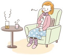 温かい部屋にいる女性