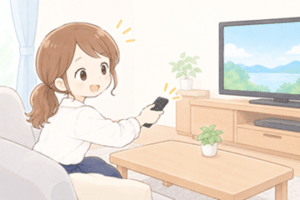 テレビリモコンを操作する女性
